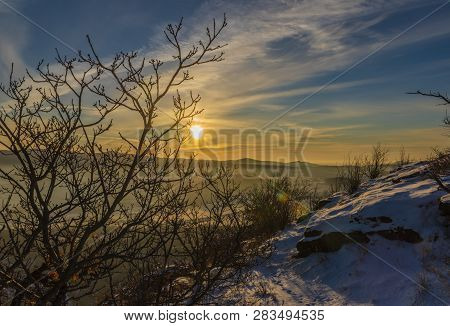 Sunrise On Boren Hill Near Bilina Town In Winter Frosty Color Morning