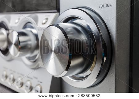 Metal Volume Control Knob On A Foreground Of The Home Stereo Mini Music System Close-up At Selective