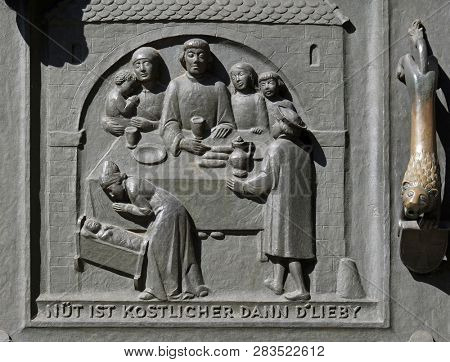 ZURICH, SWITZERLAND - JUNE 23, 2018: Zwingli and his family, relief on the door of the Grossmunster (