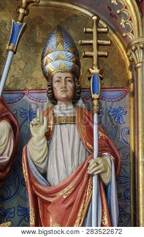 PETSCHIED, ITALY - JULY 14, 2018: Saint Sylvester statue on the main altar in the Saint Nicholas church in Petschied near Luson, Italy