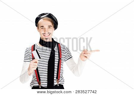 Cheerful French Man Holding Credit Card And Pointing With Finger Isolated On Shite