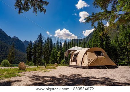 Camping on the shores of lake. Lake Dobbiaco in the Dolomites, Beautiful Nature Italy natural landscape Alps.