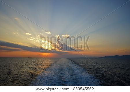 Beautiful Sunset On The Sea Seen From The Ferry On The Route To Mykonos In The Cyclades Islands, Gee