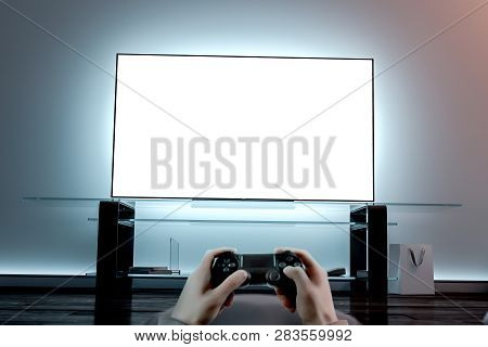 Playing Videogame With Joystick Near Blank White Tv Screen Mockup, 3d Rendering. Empty Display Mock 
