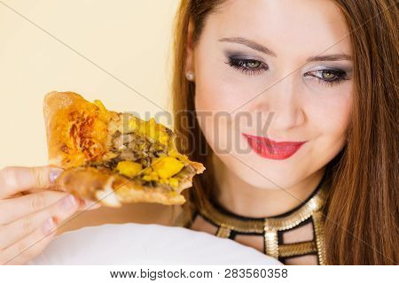 Woman Eating Hot Pizza Slice