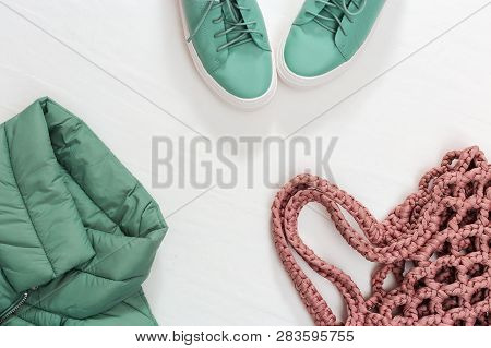 Warm Women's Clothing Warm Jacket, Shoes And Stylish Bag. Top View. Copy Space.