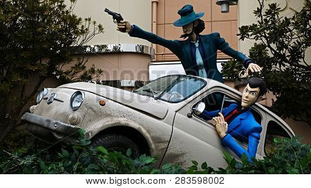 Osaka, Japan - Feb 11 2019 : Lupin The 3rd Car Chase Xr Ride At The Entrance Of Lupin And  Jigen Fig