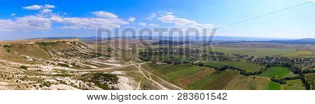 Top View From White Rock Or Aq Qaya On A Sunny Summer Day. Crimea. White Limestone With A Vertical C