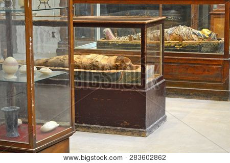 Cairo, Egypt - 19th May, 2018: Mummy On The Glass Case In The Egyptian Museum In Cairo. Ancient Exhi