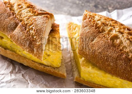 Bocadillo De Tortilla Española. Spanish Potato Omelette Sandwich On Wooden Table. Close Up