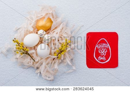 Five Easter Eggs In Paper Nest. Nest With Chicken And Artificial Eggs Decorated With Pussy-willow. C