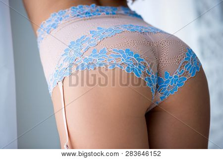 Close Up Half-turned Of Ideal Elastic Flawless Beautiful Womans Ass Wearing Blue Underlinen Underclo