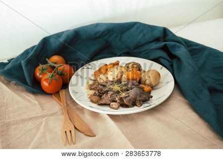 Beef meat stewed with potatoes-Traditional French cuisine Beef Bourguignon potatoes carrots in persillade