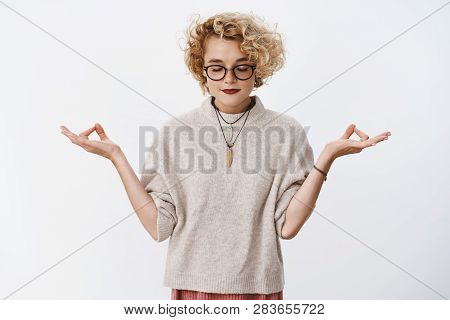 Oh Yes Relaxtion. Relieved And Calm Good-looking Stylish Queer Girl With Blond Hair And Glasses Clos