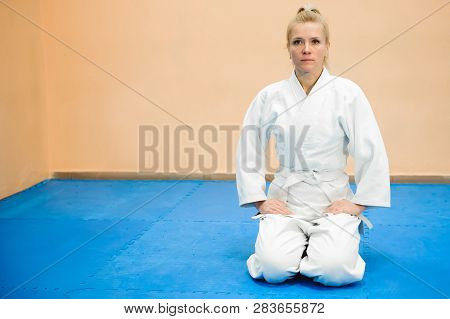 Young Girl Dressed In Hakama Practicing Aikido.