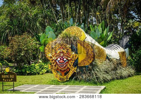 Bali Barong From Indonesia On The Middle Of Garden Park With Green Grass And Background - Photo Indo