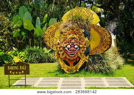 Bali Barong From Indonesia On The Middle Of Garden Park With Green Grass And Background - Photo Indo