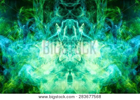 Dense Multicolored Smoke Of   Blue And Green Colors In The Form Of A Skull, Monster, Dragon On A Bla