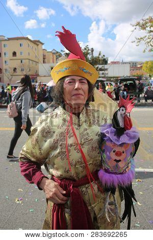 LOS ANGELES - FEBRUARY 9, 2019: Golden Dragon Parade in the streets of China Town Los Angeles. Chico McRooster and his people perform wave and visit with guest at the Chinese New Year celebration.

