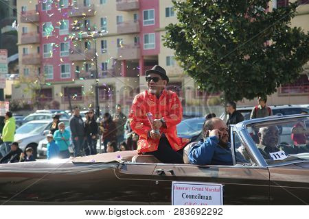 LOS ANGELES - FEBRUARY 9, 2019: Golden Dragon Parade in the streets of China Town Los Angeles. Councilman Gil Cedillo waves to the crowd at the Chinese New Year celebration 2019.

