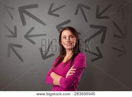 Business person choosing between two directions