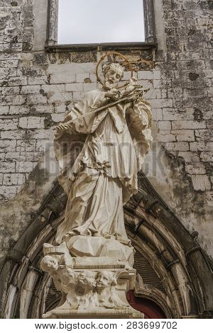 Lisbon, Portugal - July 19 2018: Carmo Chruch Convent Statue. Sculpture Of John Of Nepomuk In The Ma