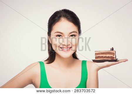 Beautiful Smiling Asian Young Woman With A Chocolate Cake Isolated On White Background.