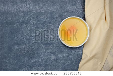 Creative Layout Made Of Broth And Napkin On Grey Background. Rich In Protein, Specifically Gelatin A