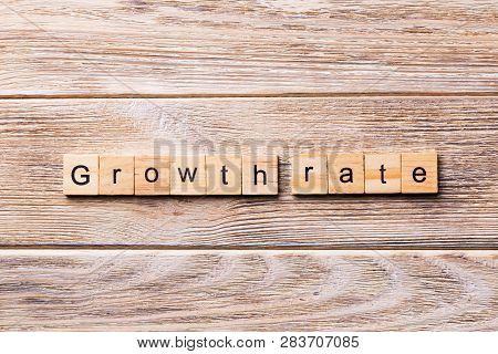 Growth Rate Word Written On Wood Block. Growth Rate Text On Wooden Table For Your Desing, Concept