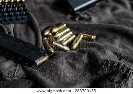 Fmj 9Mm Automatic Pistol Ballistic On Cloth Background