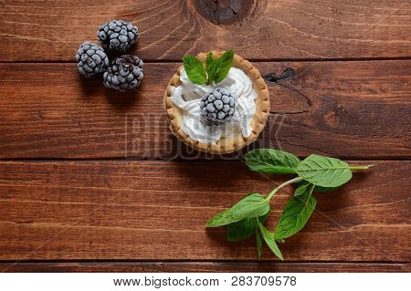 Delicious Tartlets On A Wooden Background. Blackberry With Cream - Dessert.healthy Homemade Berry De