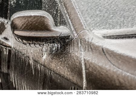 Close Up Shot Of A Frozen Car Mirror After Freezing Rain.