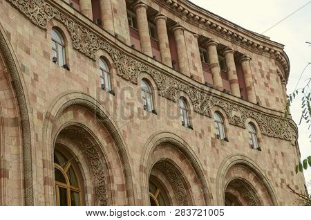 The Upper Corner Of The Administrative Building On The Square In Yerevan Built Of Colorful Stone, Wi