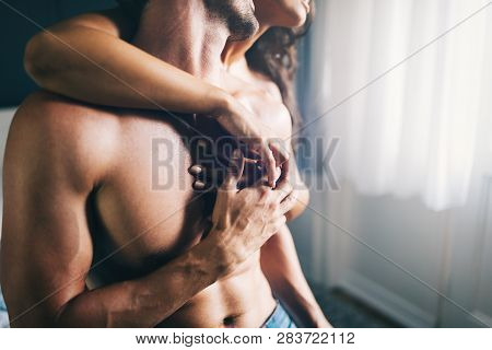 Young Sexy Hot Couple In Love Hugging And Kissing