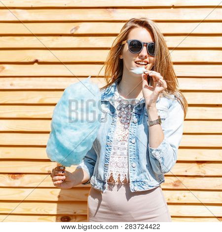 Positive Happy Young Hipster Woman In Black Sunglasses In A Stylish Denim Jacket In A Lace Blouse In