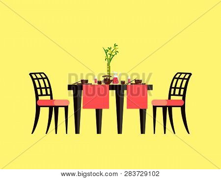 Table Serving With Ceramics Teapot And Cups, Plates With Hashi, Glass With Drink. Board With Chairs 