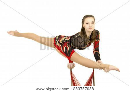 Flexible Equilibrist Performs Exercises On Acrobatic Walking Sticks.