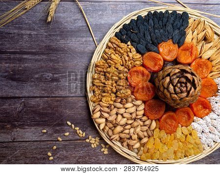 Mix Of Nuts As Walnuts, Almond, Cedar, Pistachios, And Dried Apricots, Blue And Yellow Raisin Wheat 