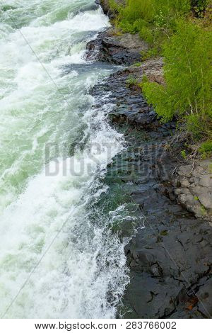The Spokane River In Spring Flood Near Downtown Spokane, Washington, Usa