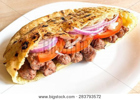 Delicious Serbian Beef Kebab Sandwich In Pita Bread With Fresh Salad Ingredients