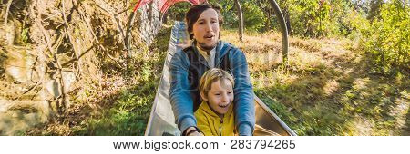 Dad And Son Have Fun On Alpine Roller Coaster Banner, Long Format