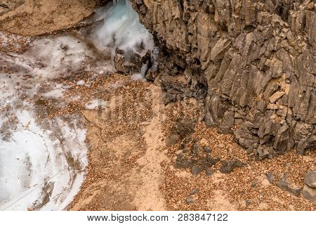 View Of Bottom Of Crater With Ice Flow And Edge Of Frozen Pond.