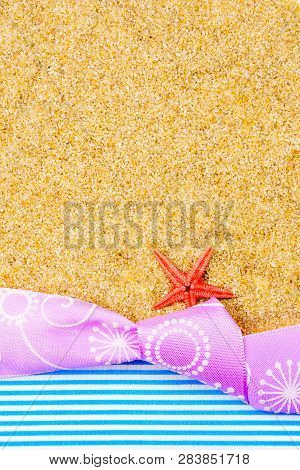 Holiday Gift Card With Violet Bow And Ribbon In The Middle Of Decoration With  Sea Shells On Backgro