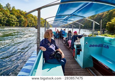 Rhine, Switzerland - September 19, 2018: Tourists Coming In The Boat On The River Rhine Near The Rhi
