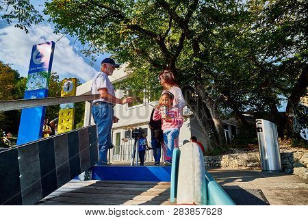 Rhine, Switzerland - September 19, 2018: Tourists Coming In The Boat On The River Rhine Near The Rhi