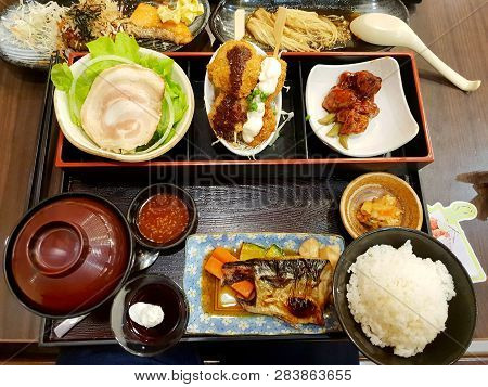 Japanese Food Style, Top View Of Grilled Mackerel Steak, Rice, Chashu Pork Slices, Pork Cutlet Toppe