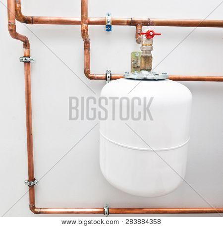 A lot of copper pipes in the boiler-room and expansion tank