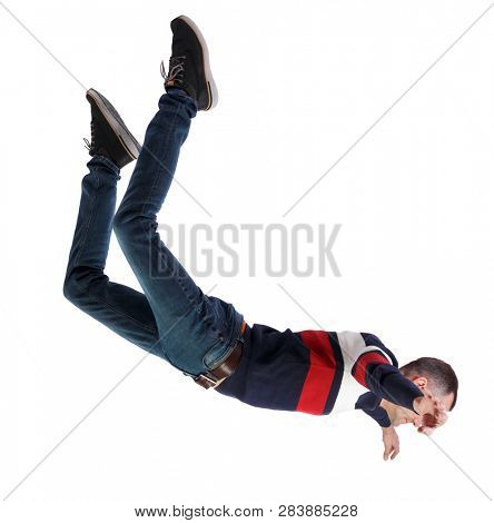 Side view of man in zero gravity or a fall. guy is flying, falling or floating in the air. Side view people collection.   Isolated over white background. A man in a striped sweater in free fall.