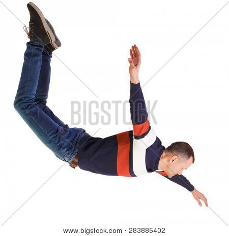Side view of man in zero gravity or a fall. guy is flying, falling or floating in the air. Side view people collection.  side view of person.  Isolated over white. The guy in jeans falls wide apart.