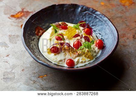 Buratta with caviar and cherry tomatoes